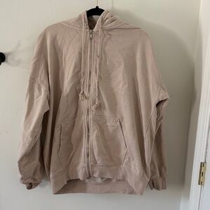 Beige “Brandy Melville” hoodie, size large.